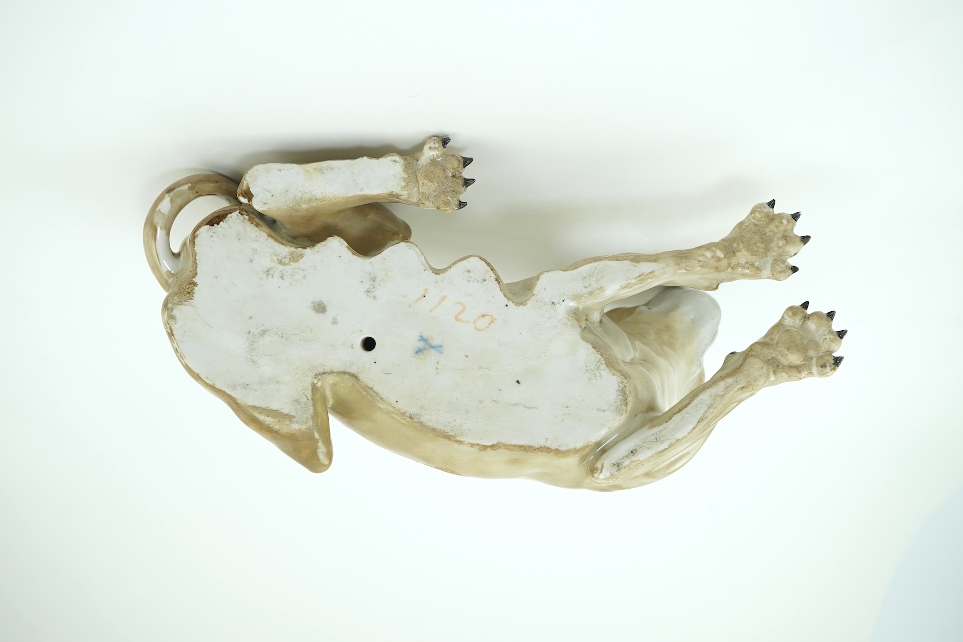 A Meissen model of a recumbent lioness, after J. J. Kandler, 19th century